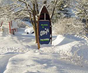 Gilly's Snug Harbour Restaurant and Marine on a sunny, snowy winter day.