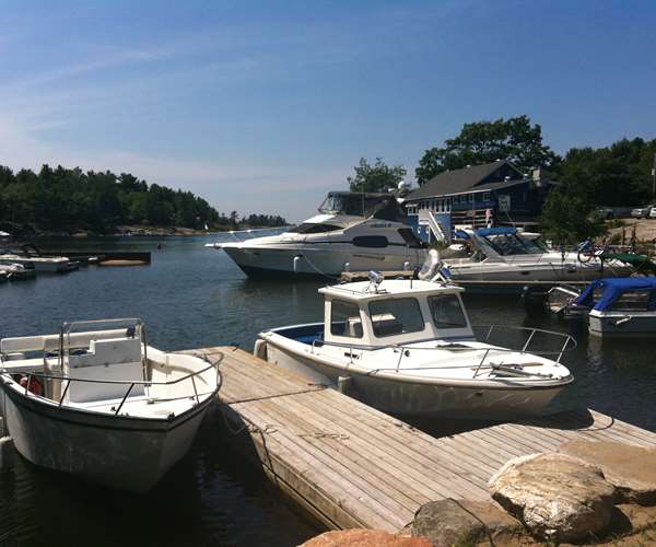 Docks at Gilly's Snug Harbour Restaurant and Marine on a sunny Summer day.